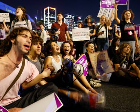 Protesters take part in a rally demanding that Israel-Arab parties in Israel be included in the formation of the next government coalition.