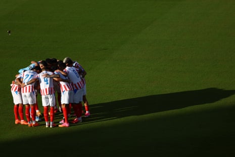 General view as Paraguay players huddle before the match