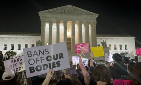 A crowd gather outside the US supreme court in Washington on Monday night after a draft opinion indicated the court has provisionally voted to overturn the 1973 case Roe v Wade, the landmark ruling that legalised abortion nationwide in America.