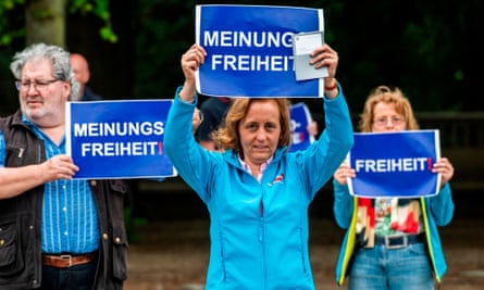 Deputy leader of the far-right Alternative for Germany party Beatrix von Storch holds up a placard reading: ‘Freedom of Speech’ during an anti-lockdown protest in Berlin.