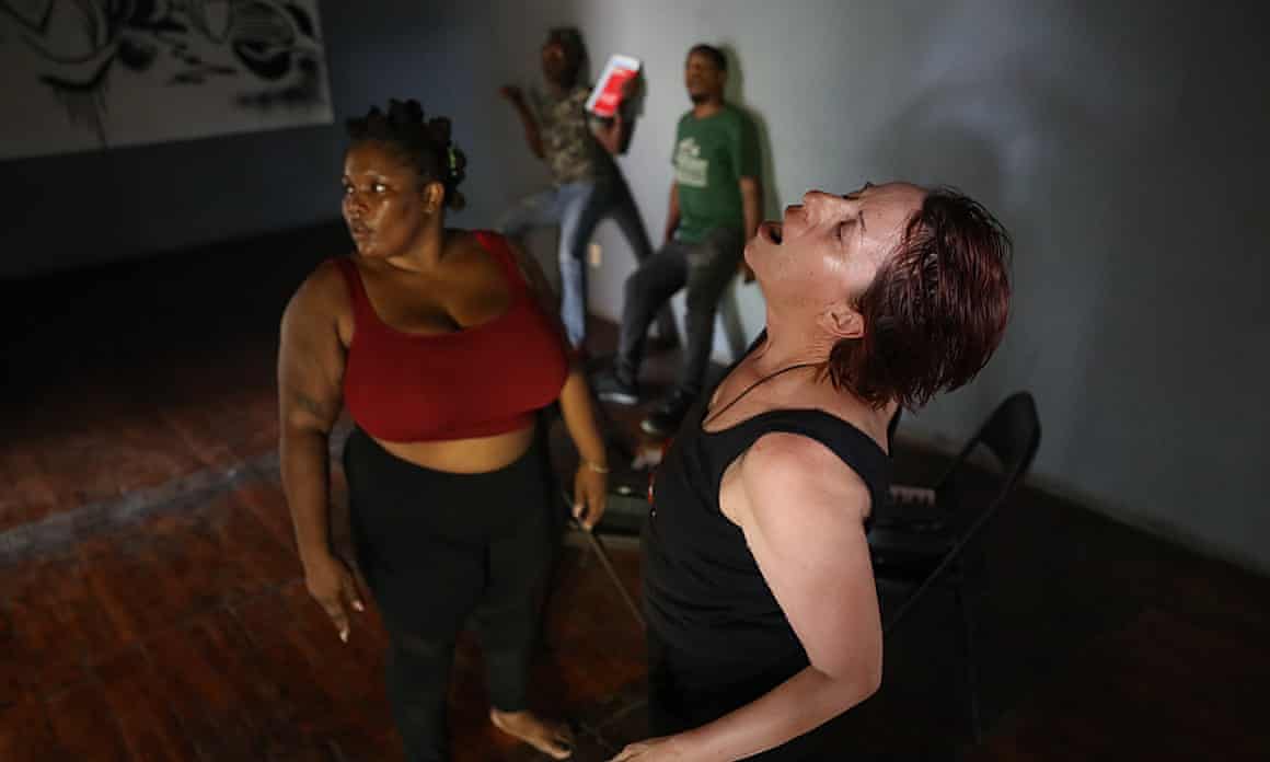 A theater troupe performs sketches reflecting the violence in Haiti during a training session for the En Lisant festival in Port-au-Prince, Haiti, in October.