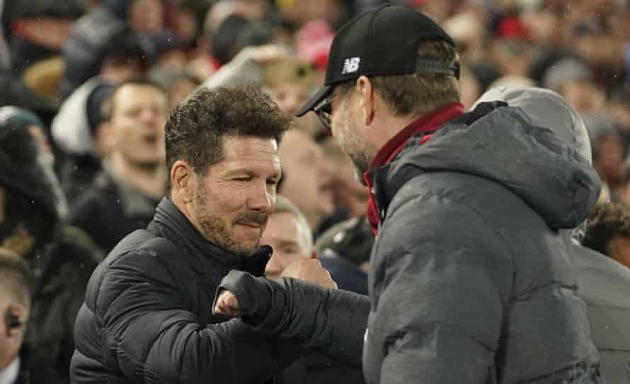 The managers’ pre-match handshake between Diego Simone and Jurgen Klopp was replaced by a forearm bump