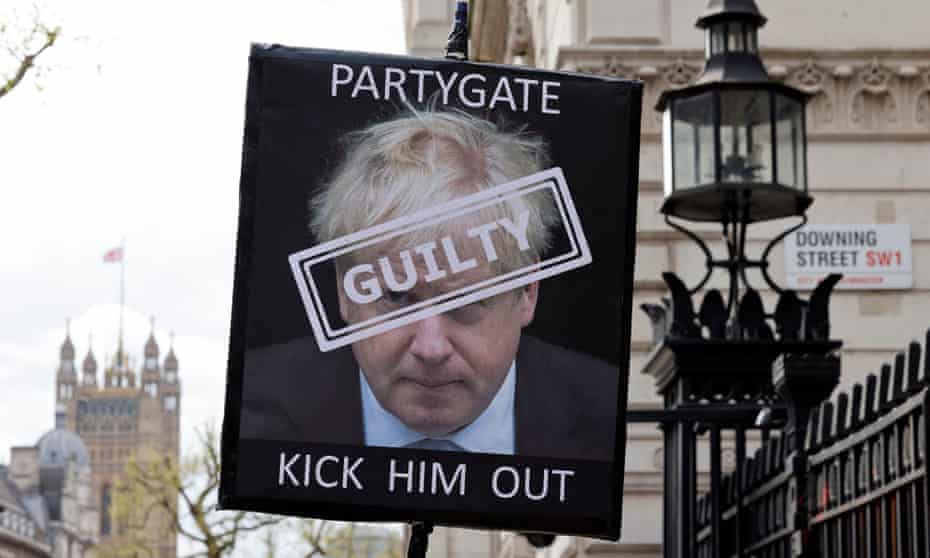 A placard calls for the resignation of Boris Johnson outside the entrance to 10 Downing Street, London.