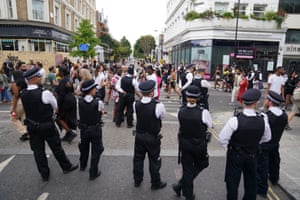 Police officers looking at revellers