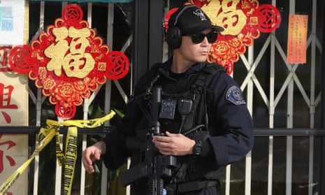 A police officer responds after a mass shooting at a ballroom dance studio in Monterey Park, California, which left 10 people dead and at least 10 others in hospital during lunar new year celebrations.