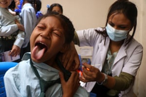 Kathmandu, Nepal A young girl receives a Covid-19 vaccine as the government begins its campaign to vaccinate under-12s