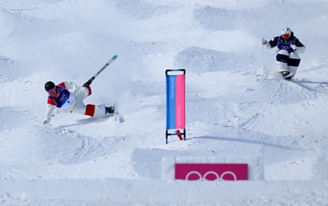 Julien Viel of Team Canada crashes as he competes against Takuya Shimakawa of Team Japan.