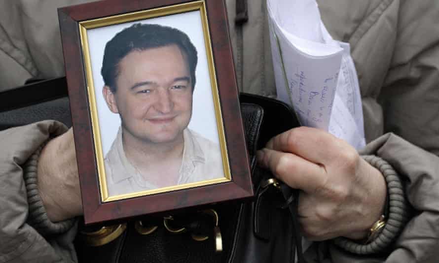 A portrait of the lawyer Sergei Magnitsky, held by his mother