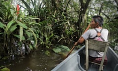 Victor exploring the flooded forest by the lake, Yasuni National Park, Ecuador