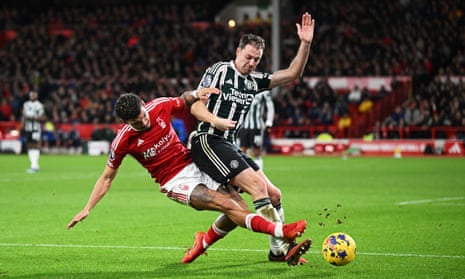 Jonny Evans of Manchester United is tackled by Morgan Gibbs-White