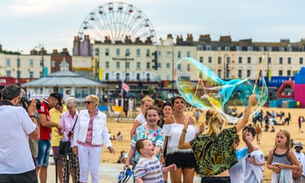 Blowing Bubbles on the promenade at Margate seaside, Kent,