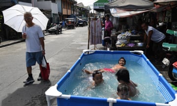 People seek relief from a heatwave in Manila, the Philippines