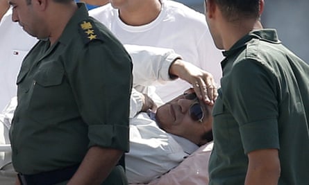 Mubarak is returned to hospital after a court hearing in 2013.