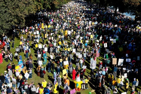 People gather for a "No Kings" protest against president Donald Trump's policies, at Waterfront Park in Portland, Oregon, U.S., October 18, 2025.