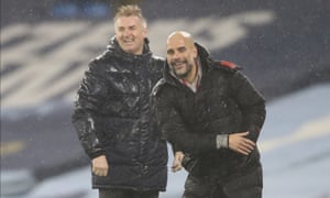 Aston Villa’s Dean Smith, left, and Manchester City’s Pep Guardiola are enjoying themselves despite being drookit.