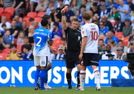 Josh Dacres-Cogley is shown a red card for pulling the hair of Ibrahim Cissoko.
