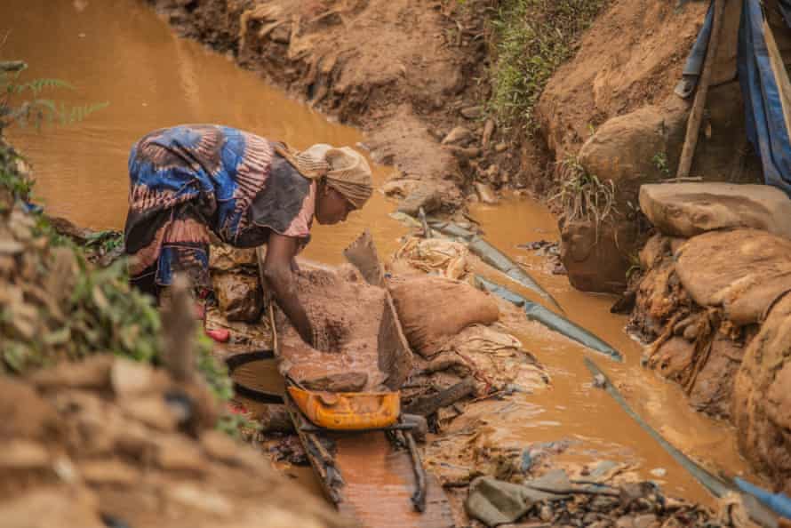 A woman pans for gold in Kamituga in DRC’s South Kivu Province in March.