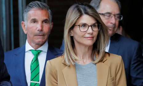 Lori Loughlin and Mossimo Giannulli leave the federal courthouse in Boston, Massachusetts, on 3 April. 