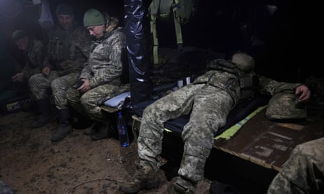 Ukrainian servicemen rest in an underground shelter on the frontline near the town of Bakhmut