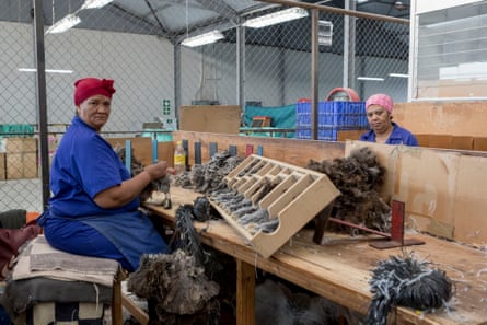 Workers in the feather sorting and sizing workshop of the Klein Karoo International agricultural cooperative factory.