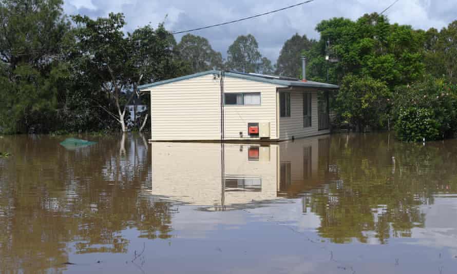 A house is seen surrounded by flood waters from the Mary River in the town of Tiaro, 198km north of Brisbane.