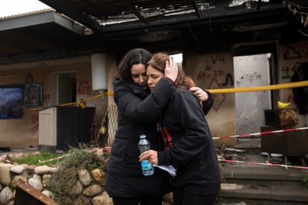 A woman hugging another woman