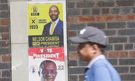 Zimbabwe 2023 election A man walks past election campaign posters of Nelson Chamisa (top) of Citizens Coalition for Change.