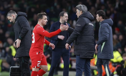 Xherdan Shaqiri shakes hands pinch his manager, Murat Yakin.