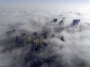 The tops of high-rise buildings in fog