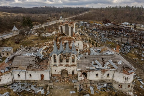 Aerial view of the collapsed nave of a large white church