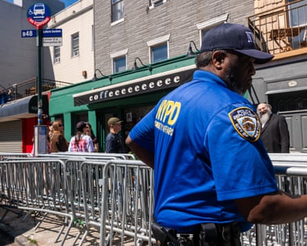 Police set up barricades outside a coffee shop.