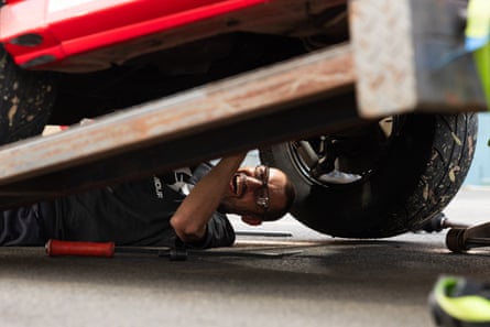 Eden Abela repairs his car.