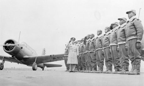 Major James Ellison, left, returns the salute of Mac Ross of Dayton, Ohio, with cadets at the Tuskegee Institute in January 1942.