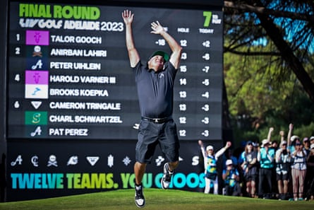 Pat Perez leaps in the air in front of a big scoreboard