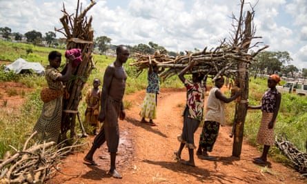 Burundian refugees return from an hours-long trip outside the Nyarugusu refugee camp to collect firewood.