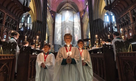Choirboys at Salisbury Cathedral for a candlelit Christmas service.