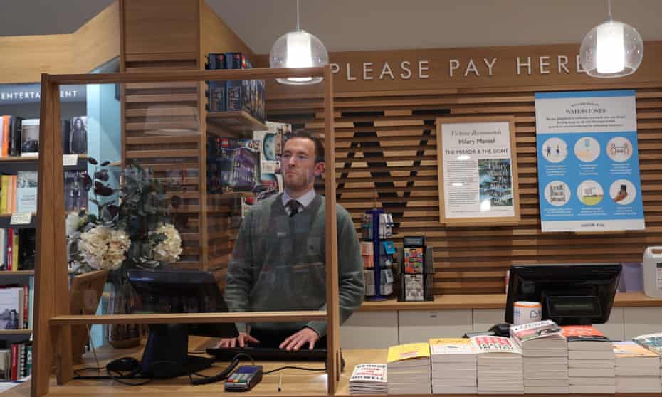 screens protect staff in a London branch of Waterstones.