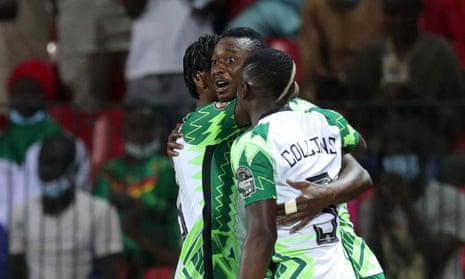 Sadiq Umar of Nigeria (centre) is congragulated by his teammates after opening thscoring in their match against Guinea Bissau.