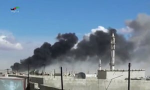 Smoke rises after airstrikes by military jets in Talbiseh, Homs province, on Wednesday.