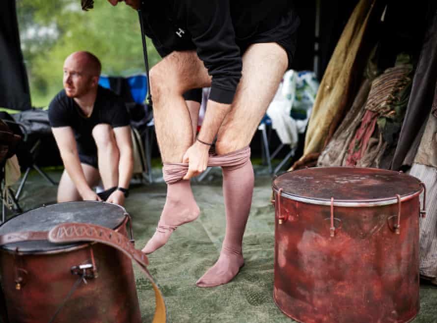 Harry Clarke (Ross, Seyton) centre, and Laurie Scott (Duncan, Porter, Lennox, Doctor) put on their tights in the cosutme gazebo set up behind the stage.