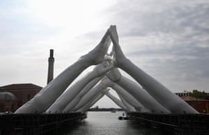 Venice, Italy: The Italian artist Lorenzo Quinn’s Building Bridges, a sculptural installation showing six pairs of arching hands creating a bridge over a Venetian waterway in a former shipyard, before the 58th International Venice Biennale art exhibition