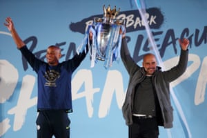 Kompany celebrates winning the Premier League title with Pep Guardiola last season.