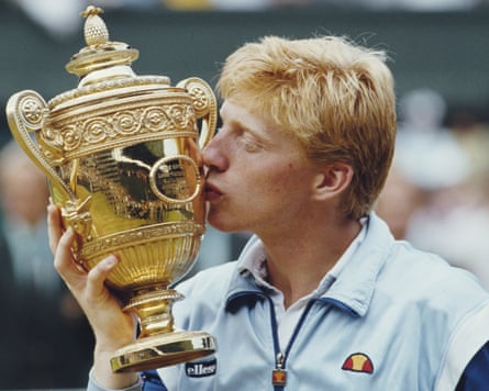 Boris Becker kisses the Gentlemen’s singles trophies after winning the 1985 Wimbledon final