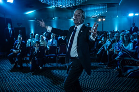 Nigel Farage leaves the stage after a speech