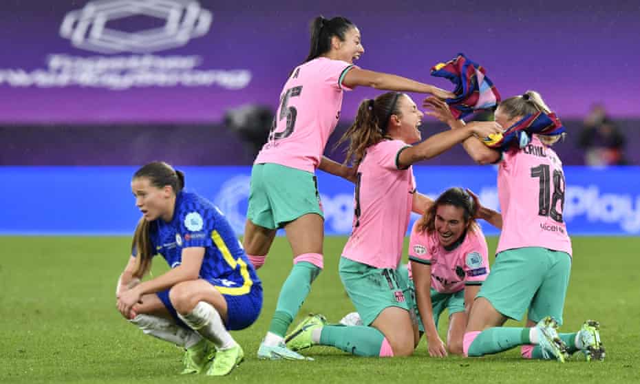 Chelsea’s Fran Kirby drops to her haunches on teh final whistle while the Barcelona players celebrate winning the Women’s Champions League in glorious style.