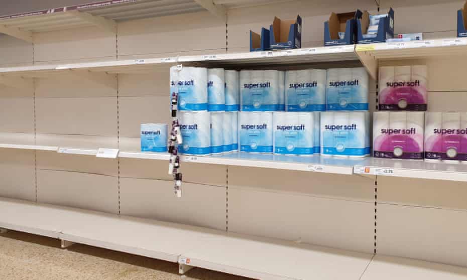 Almost empty shelves of toilet roll in a supermarket