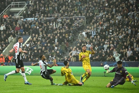 Newcastle United's Callum Wilson shoots but it's stopped by Dortmund's goalkeeper Gregor Kobel.