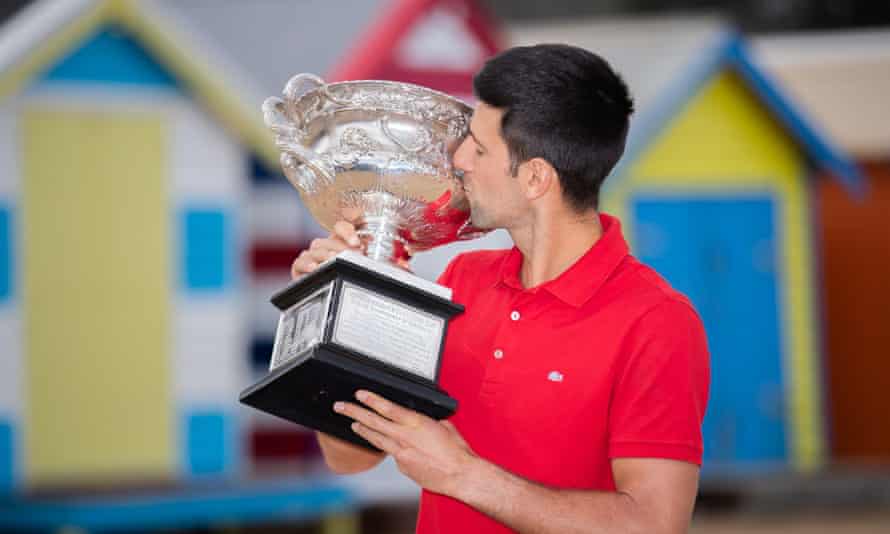 Novak Djokovic poses with a trophy at Brighton Beach after winning the 2021 tournament. This is his ninth title at Melbourne Park.