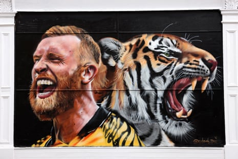 A mural of Oli McBurnie alongside a tiger.