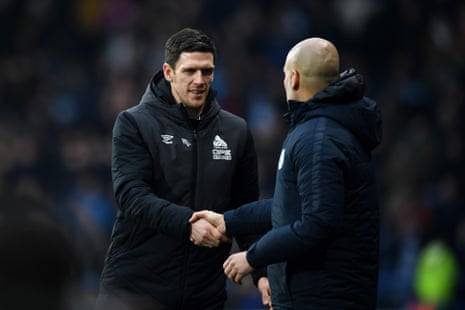 Mark Hudson shakes hands with Josep Guardiola after City’s 3-0 victory.